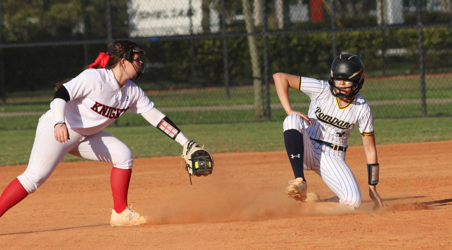 Sophomore Bridget Swanepoel reaches second base before a Monarch player can tag her out in the opening game of the season on Feb. 21. The team mercied Monarch 10-0.